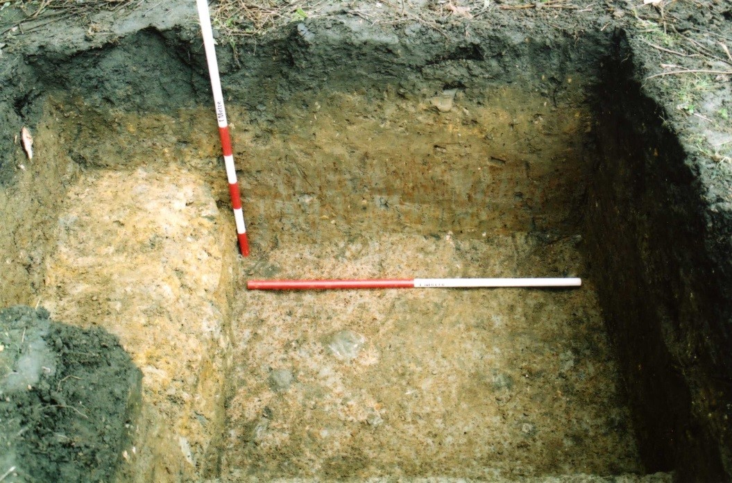 Northern end of the trench showing the cut into the natural alongside the vertical scale and the fill of the ditch